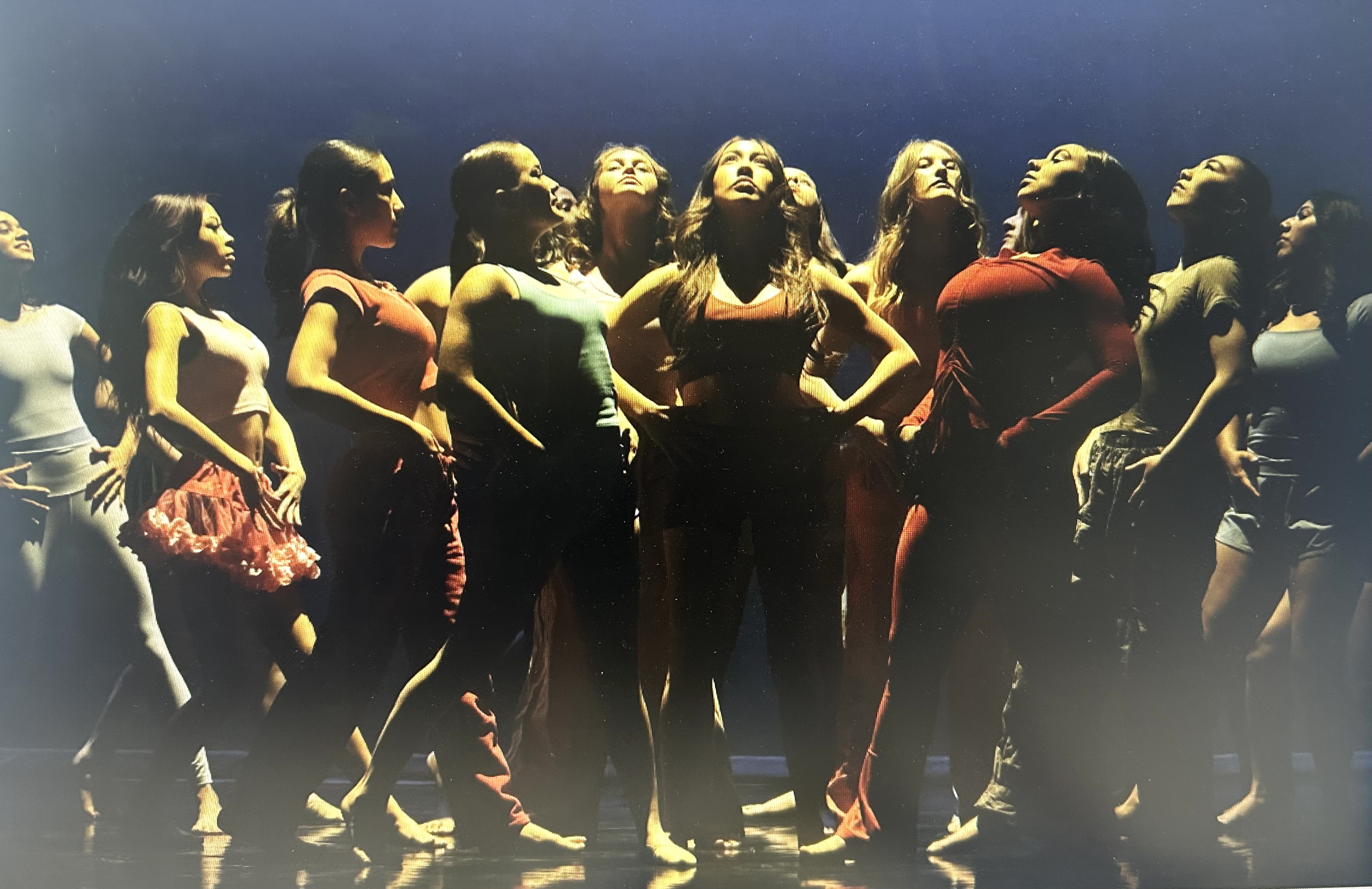 A group of dancers pose during a performance