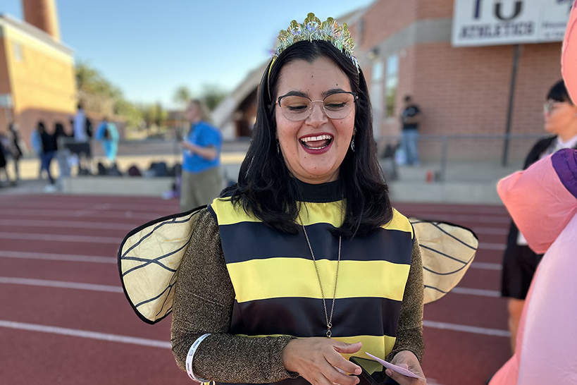 A woman dressed up as a queen bee