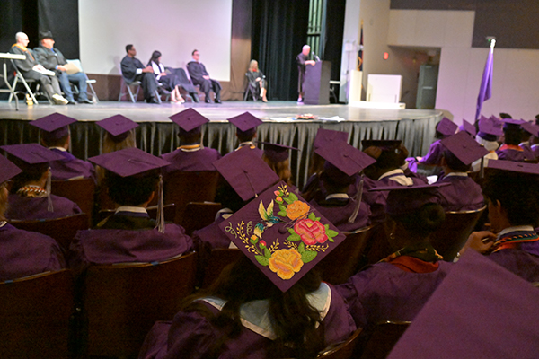 Graduates watch the ceremony
