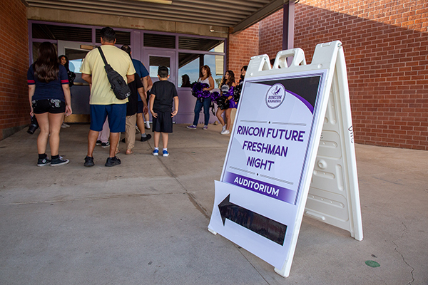 A sign points families to the Rincon Future Freshman Night in the auditorium