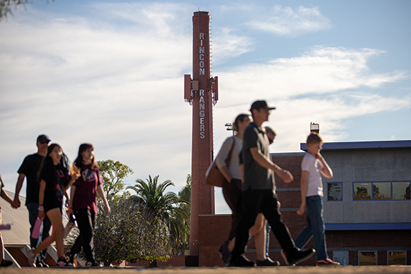 Families walk across campus during the Step Up event