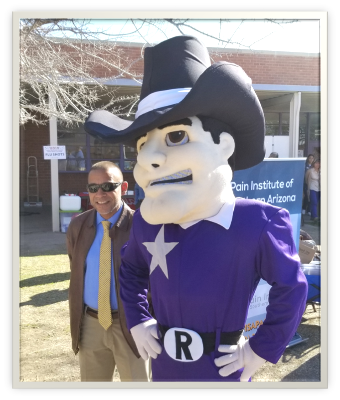 Dr. Trujillo with Mascot at the 2019 HS Expo